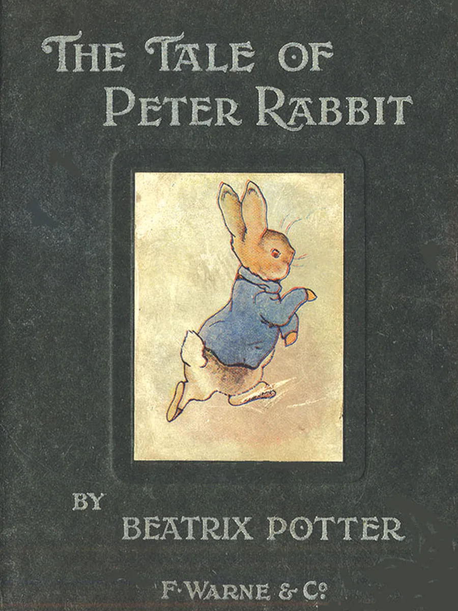 Green boards of The Tale of Peter Rabbit by Beatrix Potter, with a colour picture of Peter running and F. Warne & Co. at the foot