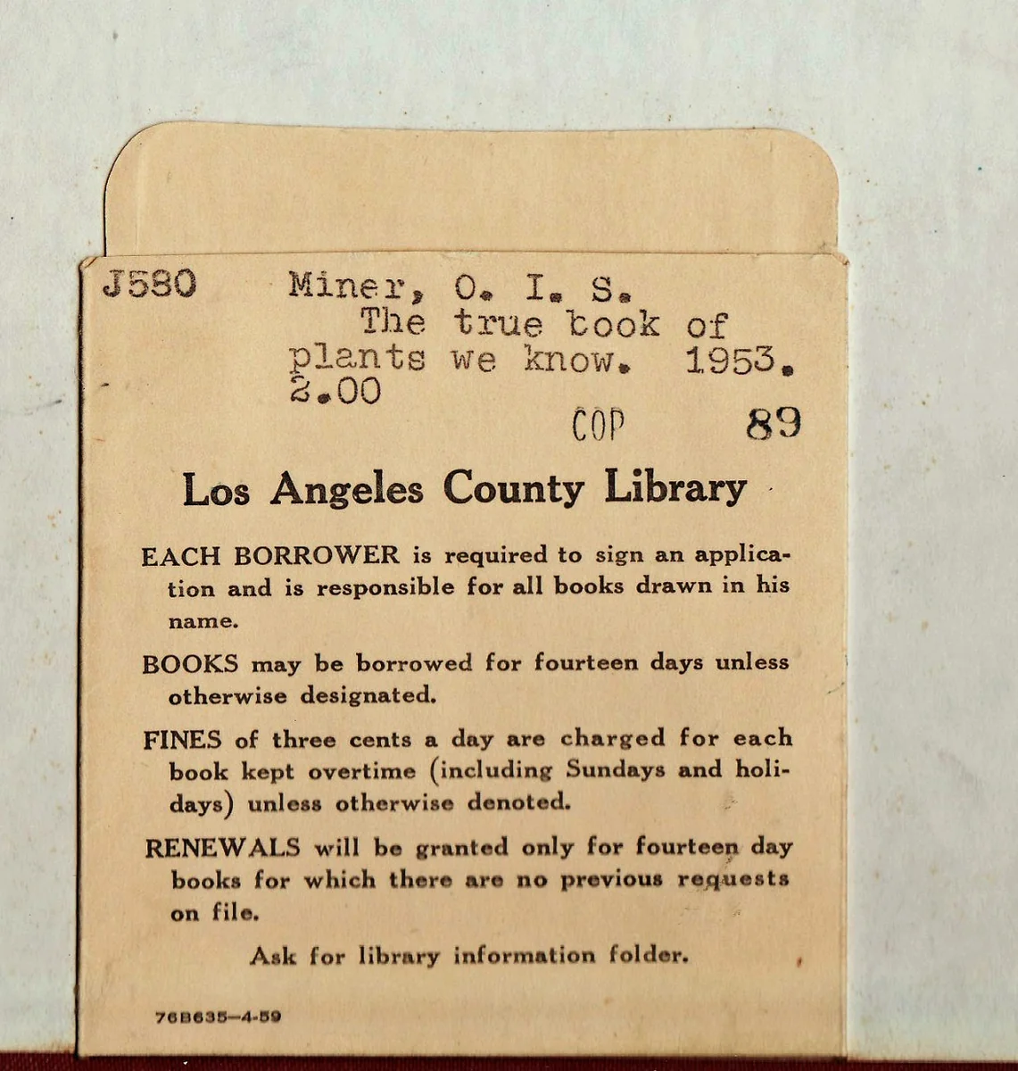 Los Angeles County Library card pocket with typed book details and printed borrowing rules