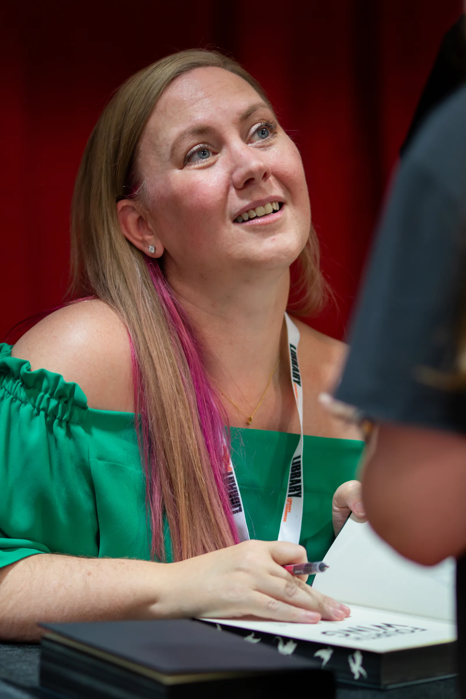 Rebecca Yarros speaking on stage at the 2024 United States National Book Festival