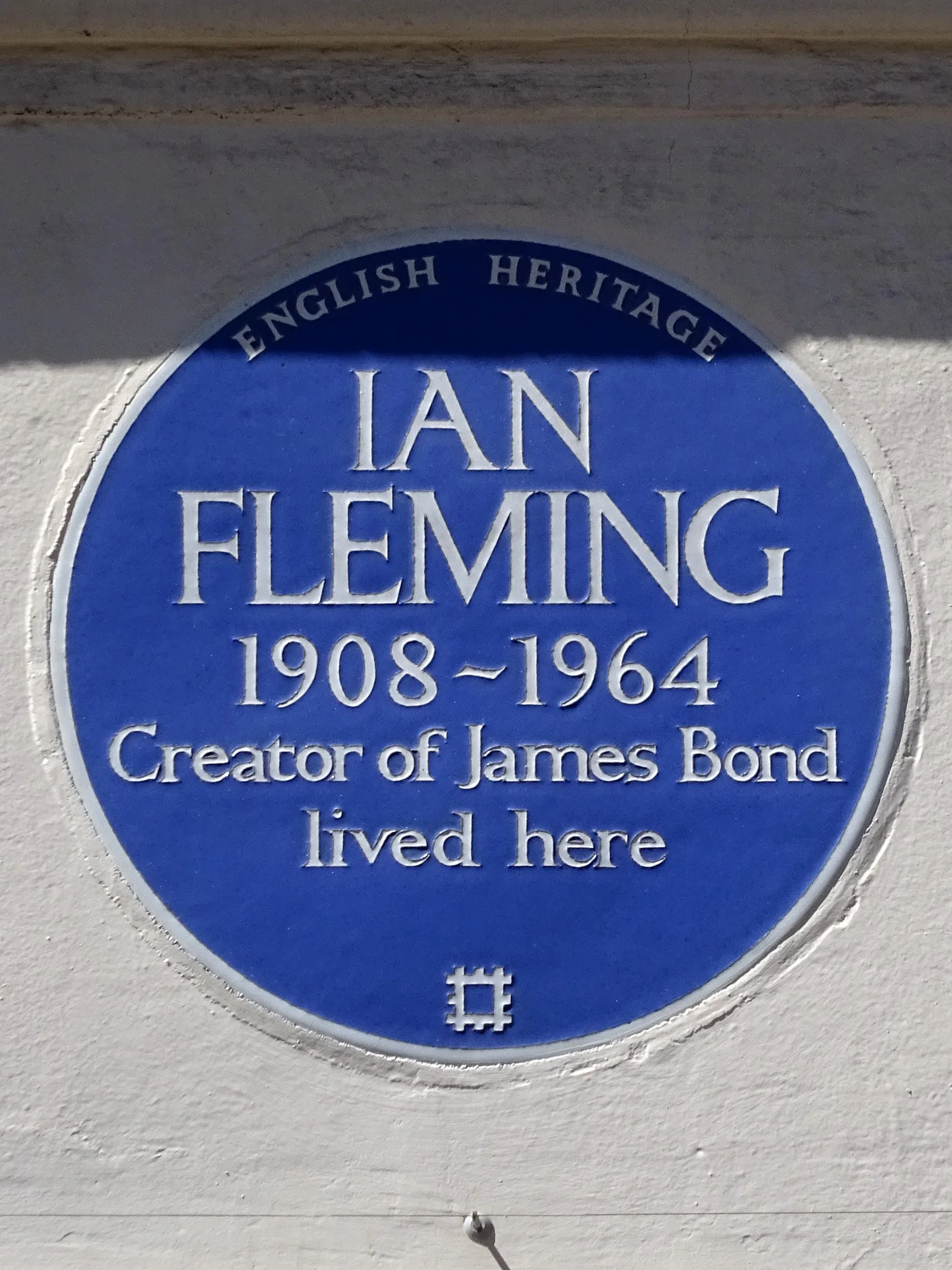 English Heritage blue plaque reading Ian Fleming 1908 to 1964, creator of James Bond, lived here, at 22 Ebury Street, London